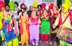 Patients, who had undergone hip-knee replacement, perform bhangra in the presence of MP Pawan Kumar Bansal and others at Sector 17 in Chandigarh on Wednesday