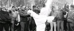 Members of the Technical Services Union of Punjab Powercom burn an effigy of the management during a protest outside their office at Phase I, Industrial Area, in Mohali on Wednesday.
