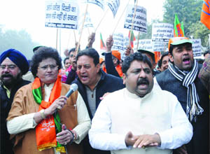 BJP activists shout slogans durng their protest against Law Minister Somnath Bharti at Secretariat in New Delhi on Wednesday.