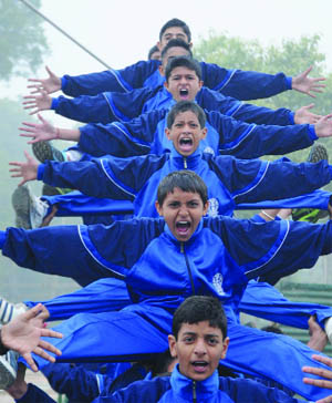 Schoolchildren perform during a rehearsal for the Republic Day parade in New Delhi on Wednesday.