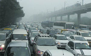 Commuters face a heavy jam near Dhaula Kuan due to traffic diversions for the Army Day parade as well as rehearsal for the Republic Day parade in New Delhi.