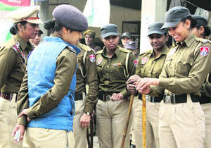 A woman constable smiles awkardly as PPS under-training officer Dr Richa Agnihotri checks her nails in Jalandhar on Wednesday.