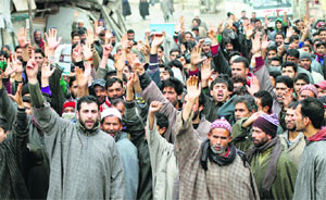 Residents of Littar in Pulwama district stage a protest on Wednesday. 