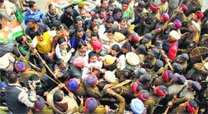 Policemen stop protesting Punjab Youth Congress workers, led by unit president Vikramjit Chaudhary, from entering the tehsil complex in Jalandhar on Wednesday.