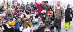 Congress workers hold protest; and (right) a couple travels on foot as the bridge connecting the old walled city with other areas remained closed in Amritsar on Thursday
