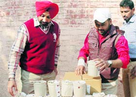 District Health Officer Shivkaran Singh Kahlon and his team collect samples during a raid in Amritsar