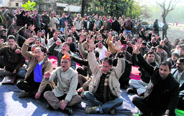 Ministerial employees protest at the Parade Ground in Dehradun on Thursday.