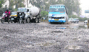 The badly damaged road from BSF Chowk to PAP Chowk in Jalandhar. 