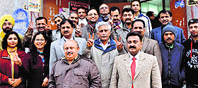 New office-bearers of the Jammu University Teachers Association pose for a photograph after their victory in the election in Jammu on Thursday
