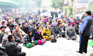 An MC official addresses employees in Ludhiana on Thursday. 