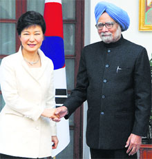 South Korean President Park Geun-hye and Prime Minister Manmohan Singh shake hands before their meeting in New Delhi on Thursday.