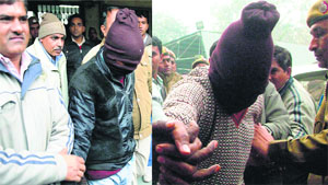 The two men accused of raping a Danish woman being taken to a court in New Delhi on Thursday.