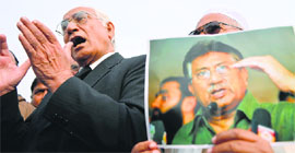 Ahmed Raza Kasuri (L), Musharrafs lawyer, speaks with mediapersons outside a special court in Islamabad on Thursday.