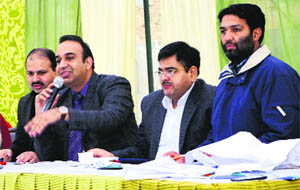 Officials of the Amritsar Improvement Trust conduct an auction of residential and commercial properties in Amritsar on Friday. 