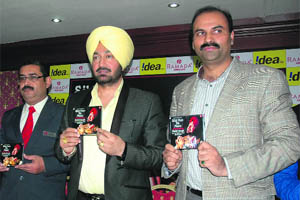 Singer Malkit Singh (centre) launches a music album in Amritsar on Friday. 