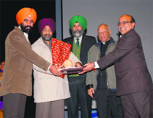 Officials of the Department of Architecture, GZS-PTU, receive award in Bathinda on Friday. 