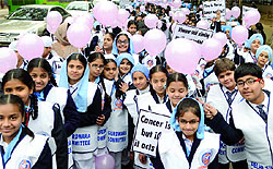 Schoolchildren take part in a cancer awareness march from Gurdwara Bangla Sahib to Gurdwara Rakabganj Sahib organized by the DSGMC in New Delhi on Friday