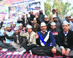 Aam Admi Party workers protest in Dehradun on Friday. 
