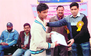 Roorkee City Cricket Association members honour a player at Roshanabad in Haridwar on Friday.