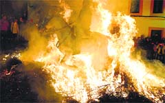 A horse-rider runs through a burning pyre in Spanish village of San Bartolome de Painares on Friday during celebrations for the feast of Saint Anthony, patron saint of animals. AFP