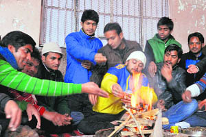 Students perform a yajna at DAV PG College in Dehradun on Saturday. 