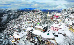 A view of snow-covered Shimla on Saturday. Photo: Amit Kanwar