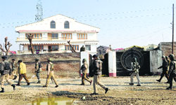 Security personnel cordon the Hyderpora area near the Srinagar-Baramulla national highway after militants opened fire at a CRPF patrol party on Saturday. Tribune Photo: Amin War