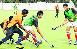 Players in action during the semifinal match of the All-India Balwant Singh Kapur Hockey Tournament in Jalandhar on Saturday
