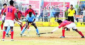 Players vie for the ball; and (right) cyclists pedal their way to glory during the 28th Coca Cola Jarkhar Sports Festival in Ludhiana.