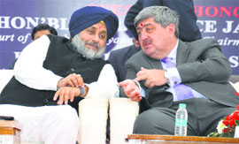 Punjab and Haryana High Court Chief Justice Sanjay Kishan Kaul (right) with Deputy Chief Minister Sukhbir Singh Badal in Bathinda on Saturday.