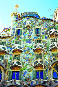 A wave-like roof and balconies embellish the glittering Casa Batllo, designed by the Catalan architect Antonio Gaudi y Cornet, ca. 2 1905. Barcelona, Spain. | Location: Barcelona, Spain