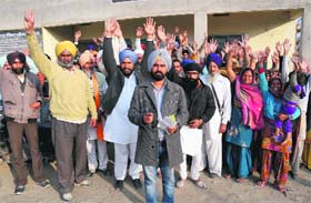 Supporters of ex-councillor Manjit Singh raise slogans in his support on Sunday
