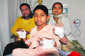 Milan Sidhu shows his injuries at a hospital