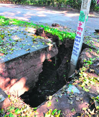 A drain caved in following showers in Phase XI, Mohali.