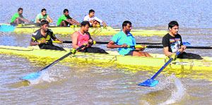 Players in action during the Chandigarh State Senior Rowing Championship held at the Sukhna Lake, Chandigarh, on Sunday.