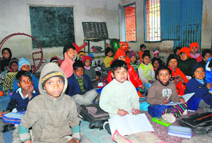 Students made to sit on the floor at Government School, Sector 15, Panchkula.