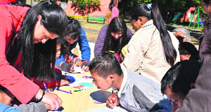 Making a Difference (MAD) volunteers with the inamtes of Raphael Home in Dehradun on Sunday.