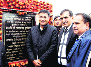 PWD and Industries Minister Randeep Singh Surjewala dedicates to the people a road named after Lekh Raj Miglani at Kaithal on Saturday. 