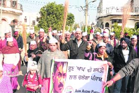 Awakening the common man: Aam Aadmi Party (AAP) activists carry out an awareness rally in Jalandhar on Sunday