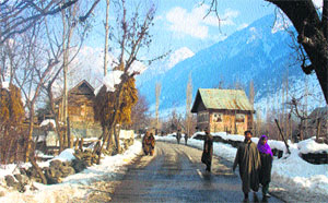 Gagangir, 80 km east of Srinagar, with snow-capped mountains in the background