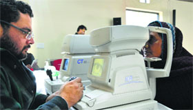 A woman gets her eyesight checked at a medical camp in Ludhiana on Sunday.