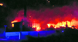 Flames destroy houses in the village of Laerdal on Sunday. Officials say a large fire has blazed through a historical village famous for its well-preserved wooden houses from the 18th and 19th centuries, destroying at least 23 buildings