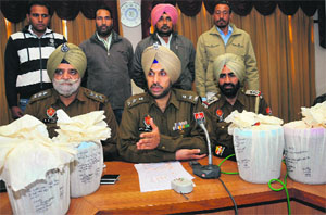 SSP Gurpreet Singh Bhullar addresses a press conference after arresting drug peddlers in Bathinda on Monday