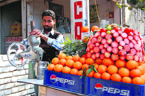 Pawan Sharma sells juice at his shop in Bathinda