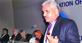Prof Ghanshyam Chauhan from Himachal Pradesh University, Shimla, addresses a conference in Dehradun on Monday.