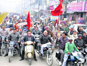 Government employees take out a rally during strike in Karnal on Monday.