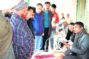 DC KS Vasant listens to the grievances of people at a Prashasan Janta Ke Dwar at Sillagharat village in Chamba on Saturday