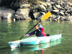 Rafting expert Luxmi Thakur during kayaking at Hatkoti in Shimla district.