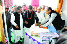 Industry Minister Mukesh Agnihotri inspects a product at the khadi fair inaugurated in Una on Monday.