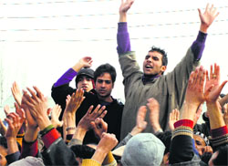 People protest against the government in Pulwama district on Monday. A Tribune Photograph